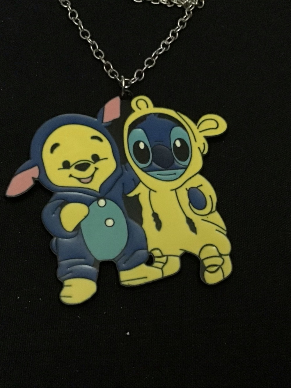 Super cute Pooh and Stitch necklace